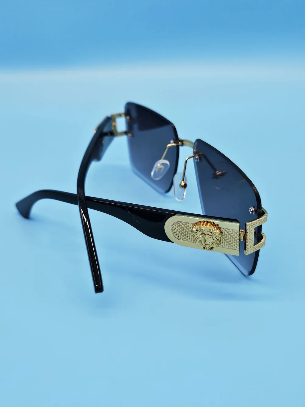 Gold-Trim Black Sunglasses with Dark Lenses